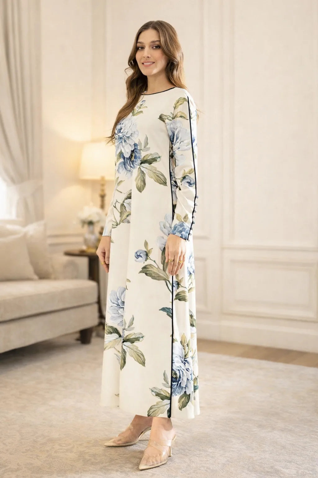 Woman wearing a floral dress in a living room setting