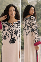 Woman wearing a floral dress with a neutral background
