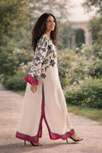 Woman in a floral dress walking in a garden
